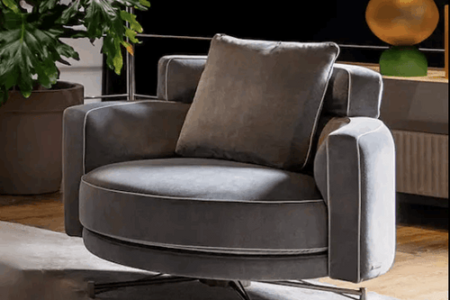 Gray upholstered Dirani chair with a cushioned backrest and seat
