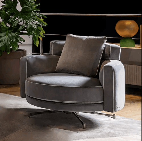 Gray upholstered Dirani chair with a cushioned backrest and seat