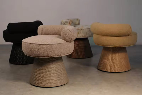 Discover the Donaire Swivel Luxury Chair, featuring bouclé upholstery and a sculpted wooden-effect base in white ash or teak look. A customisable luxury accent chair for premium interiors.