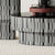 Close view of modern table with black and white patterned base 