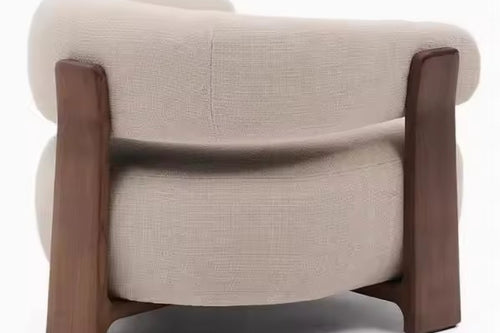 Beige armchair with wooden frame back profile
