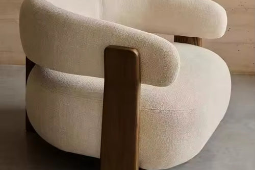 Beige accent chair with wooden legs 