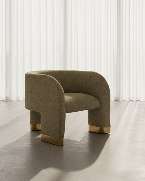 Shop the Erica Accent Chair by Chair Collective — a curved modern chair with golden accents and soft upholstery. Explore luxury accent chairs online in India.