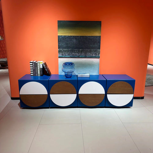 Farno Console by Chair Collective in a bold eclectic blue finish, featuring multiple storage drawers with playful contrasting circular details across the front.
