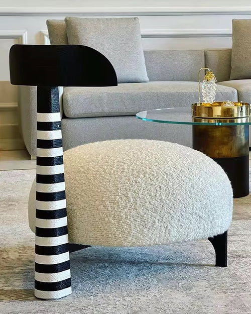 Shop the Flamingo Accent Chair online in India — handcrafted with a tall resin neck, rounded cushioned seat, and stainless steel legs. A perfect quirky luxury chair for modern interiors.