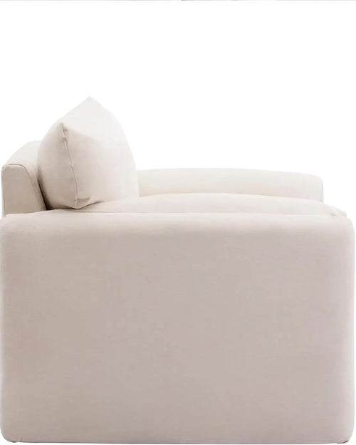 Side view of Fluffo cozy armchair