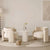 Gogh Chair highlighting its plush boucle texture and unique curved arms