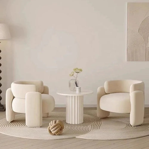 Gogh Chair highlighting its plush boucle texture and unique curved arms