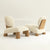Sculptural modern lounge chair featuring a plush upholstered seat, slanted backrest, and White Ash Wood frame, designed for contemporary luxury interiors.