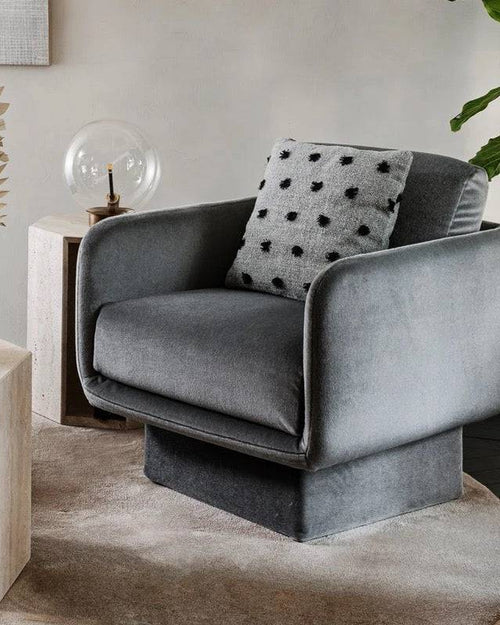 Gray Lupin chair styled in a cozy neutral-toned
