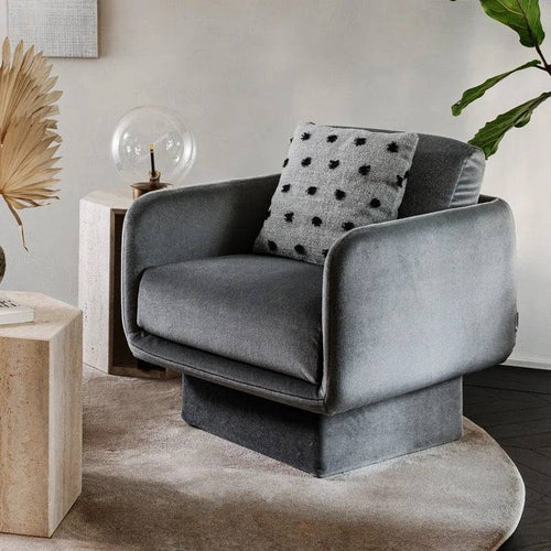 Gray Lupin chair styled in a cozy neutral-toned