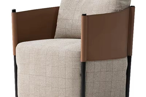 Gunter Accent Chair with a sleek metal frame and leatherite patch detailing, designed for modern luxury interiors with plush comfort and bold styling.