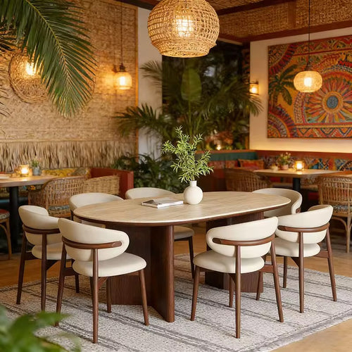 Gyros Dining Chair featuring a softly curved upholstered backrest, cushioned seat, and elegant wooden frame, designed for contemporary dining interiors.