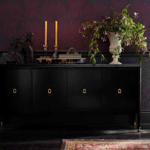 Bold black cabinet with gold pulls