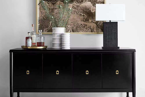 Black console with gold handles