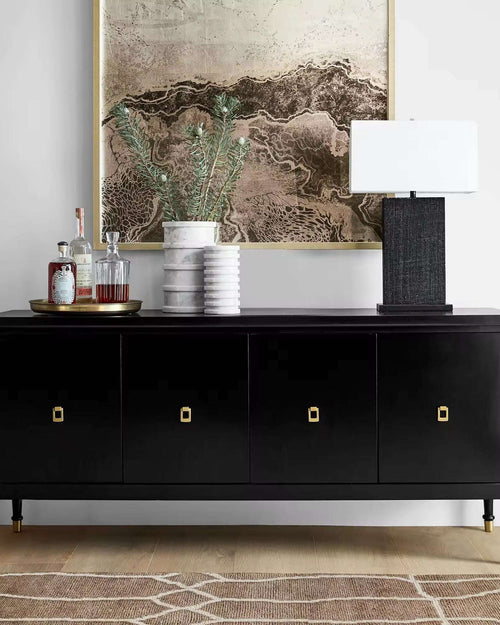 Black console with gold handles