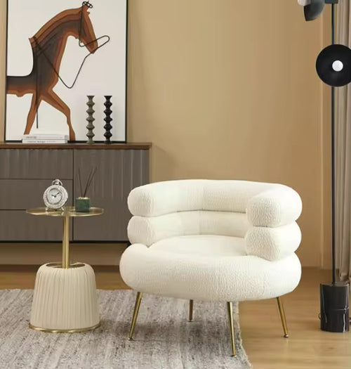 Shop the Harrier Round Accent Chair by Chair Collective – a modern luxury chair with plush boucle fabric, layered backrest, and sleek metal legs. Perfect for sophisticated living spaces in India.
