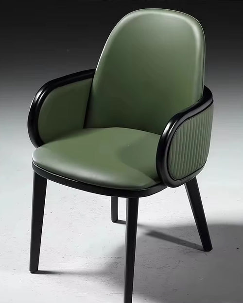 Hirdo dining chair in green with wooden legs.