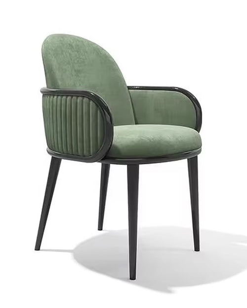 Green armchair with black ribbed armrests