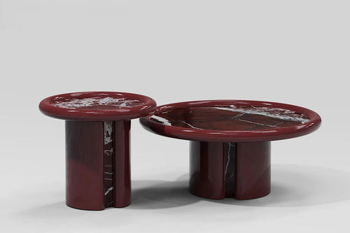 Hudson Cocktail Table featuring a sculptural cylindrical base, high-gloss red finish, and premium natural stone tabletop available in Rosso Levanto marble or White Travertine.