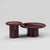 Hudson Cocktail Table featuring a sculptural cylindrical base, high-gloss red finish, and premium natural stone tabletop available in Rosso Levanto marble or White Travertine.