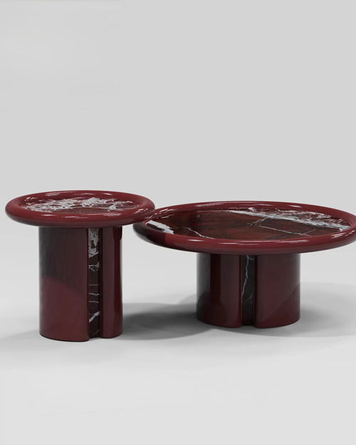 Hudson Cocktail Table featuring a sculptural cylindrical base, high-gloss red finish, and premium natural stone tabletop available in Rosso Levanto marble or White Travertine.