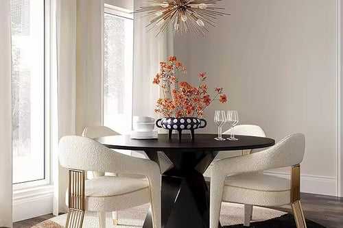 The Siena Chair is a statement in contemporary sophistication, designed to transform any dining or lounge setting into a scene of refined luxury. Upholstered in plush, creamy fabric, it offers a soft and inviting seat, perfectly balanced by its bold architectural base.