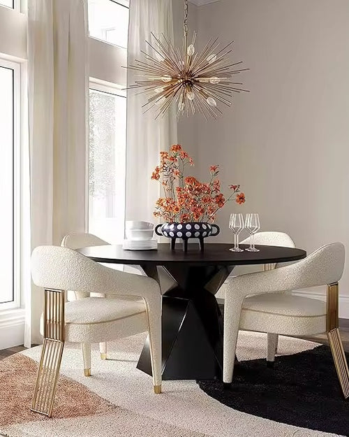 The Siena Chair is a statement in contemporary sophistication, designed to transform any dining or lounge setting into a scene of refined luxury. Upholstered in plush, creamy fabric, it offers a soft and inviting seat, perfectly balanced by its bold architectural base.