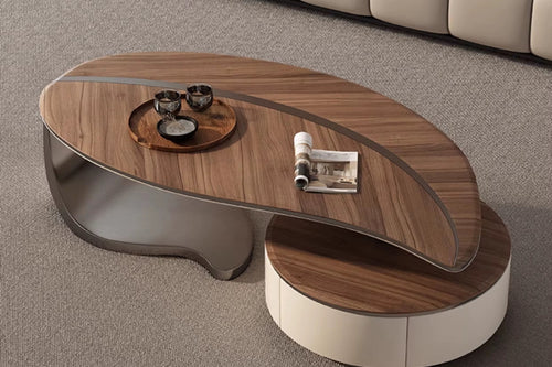 The Monroe Table is a striking composition of organic curves and bold contrasts, designed to anchor any living space with effortless style. Its asymmetrical silhouette, crafted in rich walnut veneer and glossy lacquer, creates a layered surface that is both visually captivating and functional.