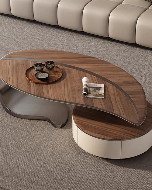 The Monroe Table is a striking composition of organic curves and bold contrasts, designed to anchor any living space with effortless style. Its asymmetrical silhouette, crafted in rich walnut veneer and glossy lacquer, creates a layered surface that is both visually captivating and functional.
