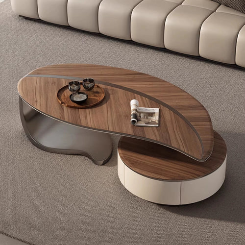The Monroe Table is a striking composition of organic curves and bold contrasts, designed to anchor any living space with effortless style. Its asymmetrical silhouette, crafted in rich walnut veneer and glossy lacquer, creates a layered surface that is both visually captivating and functional.