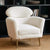 The Muse Chair is a study in refined comfort. Draped in plush boucle, its sculpted curves invite you to sink in, while the distinctive oval backrest offers both support and an iconic silhouette.