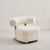 The Azure Chair is a striking blend of modern minimalism and tactile luxury. Its sculpted boucle seat wraps you in comfort, while the bold rolled backrest floats effortlessly above a sleek brushed steel frame.