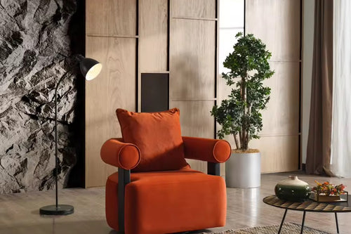 The Kyoto Chair is a statement in sculptural design—where strong architectural lines meet plush, enveloping comfort. Its cylindrical armrests and rich velvet upholstery exude sophistication, while the contrasting matte black supports add a touch of modern edge.