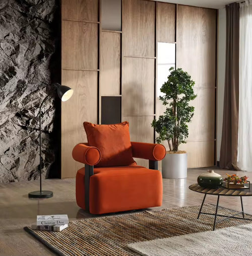 The Kyoto Chair is a statement in sculptural design—where strong architectural lines meet plush, enveloping comfort. Its cylindrical armrests and rich velvet upholstery exude sophistication, while the contrasting matte black supports add a touch of modern edge.