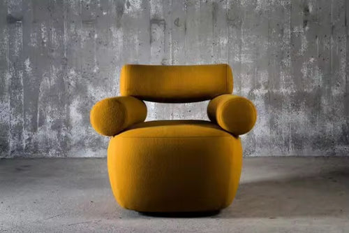 The Amalfi Chair redefines statement seating with its architectural silhouette and sculptural presence. Cylindrical arm bolsters and a contoured backrest create a harmonious balance between form and function, while the generous seat invites lingering moments of comfort.