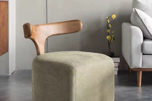 The Rumi Chair is more than seating—it’s a piece of design poetry. With its sculptural wooden backrest flowing like calligraphy and a soft upholstered base that anchors the form, it merges artistry with functionality.