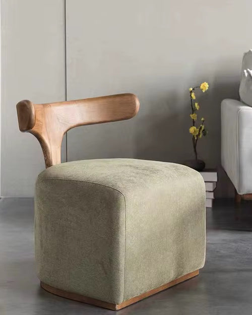 The Rumi Chair is more than seating—it’s a piece of design poetry. With its sculptural wooden backrest flowing like calligraphy and a soft upholstered base that anchors the form, it merges artistry with functionality.