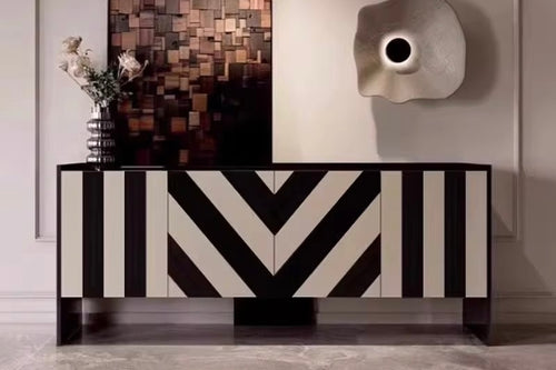 The Mosaic Console is a bold expression of luxury furniture design, crafted to bring a striking visual impact to your interiors. Featuring an artistic black-and-white geometric pattern, the console blends premium resin work with a smooth PU finish, making it both functional and decorative.