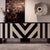 The Mosaic Console is a bold expression of luxury furniture design, crafted to bring a striking visual impact to your interiors. Featuring an artistic black-and-white geometric pattern, the console blends premium resin work with a smooth PU finish, making it both functional and decorative.
