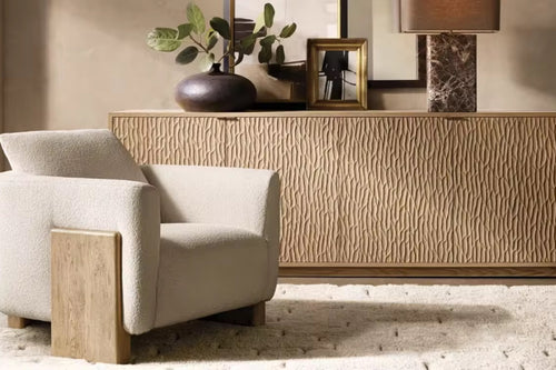 The Rune Chair brings together sculptural design and grounded elegance. Its bold silhouette is softened by plush upholstery, while the solid wooden block legs anchor the piece with a sense of stability and strength. Minimal yet striking, it’s a chair that blends comfort with architectural beauty.
