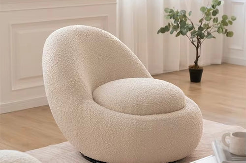 The Eggi Chair combines playful curves with practical functionality. Its egg-shaped silhouette brings a soft, modern aesthetic, while the hidden storage compartment beneath the seat adds a clever twist for contemporary living.