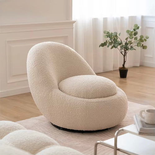The Eggi Chair combines playful curves with practical functionality. Its egg-shaped silhouette brings a soft, modern aesthetic, while the hidden storage compartment beneath the seat adds a clever twist for contemporary living.
