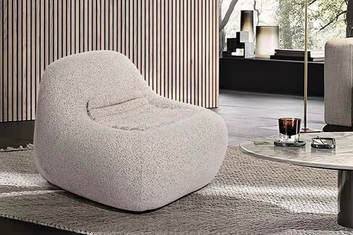 The Luma Lounge Chair combines modern design with supreme comfort, making it a standout addition to any interior. With its low-profile silhouette, rounded organic curves, and plush upholstery, this chair invites you to sit back and unwind. Designed for both relaxation and style, it’s perfect for living rooms, reading no
