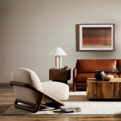 The Curo Chair is where timeless design meets modern comfort. With its architectural wooden frame and plush upholstered cushions, Curo balances strength and softness in perfect harmony. Its sculptural silhouette creates a striking statement, while the deep, inviting seat ensures everyday relaxation.
