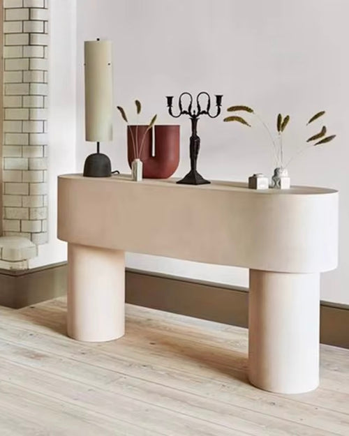 The Pola Console is a modern masterpiece that blends soft curves with structured simplicity. Its balanced cylindrical legs and smooth top create a serene and sculptural presence, making it a standout addition to any space. Designed for both style and function, Pola offers a clean, elegant surface that complements contemporary interiors. Must have entry way luxury console for a Japandi interiors. 