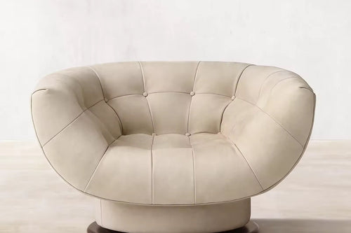 The Rowan Chair combines soft curves, deep cushioning, and luxurious upholstery to create a seating experience that’s both elegant and inviting. Its rounded silhouette and smooth texture add a sculptural element to any space, while offering exceptional comfort. Perfect for living rooms, lounges, or quiet corners, Rowan brings warmth and sophistication to modern interiors.