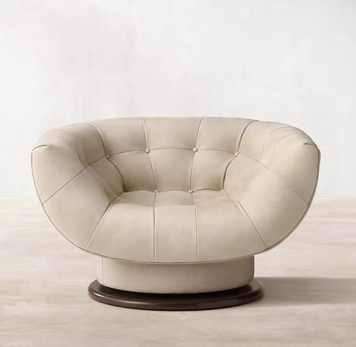 The Rowan Chair combines soft curves, deep cushioning, and luxurious upholstery to create a seating experience that’s both elegant and inviting. Its rounded silhouette and smooth texture add a sculptural element to any space, while offering exceptional comfort. Perfect for living rooms, lounges, or quiet corners, Rowan brings warmth and sophistication to modern interiors.