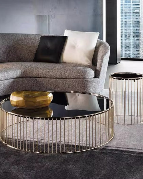 The Celeste Table bring a sense of refined sophistication and effortless luxury to any living space. Designed with slender gold-finished metal frames and sleek glass tops, these tables offer a delicate balance between structure and openness. The combination of premium materials and graceful lines creates a contemporary aesthetic that enhances both modern and classic interiors.