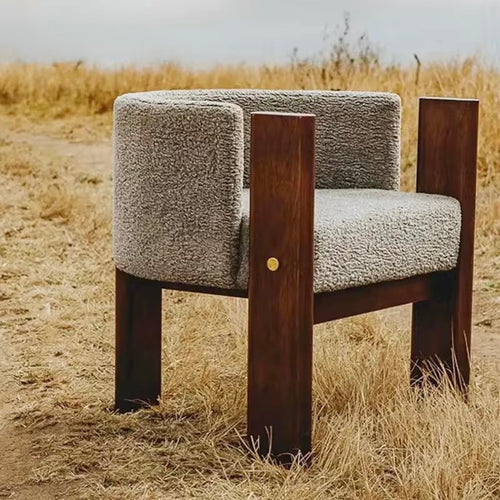 The Kors Chair is a striking blend of bold geometry and refined comfort. With its intersecting solid wood legs and softly curved upholstered seat, the chair balances architectural strength with inviting warmth. Minimal yet impactful, Kors is designed for those who appreciate furniture as both functional and sculptural.